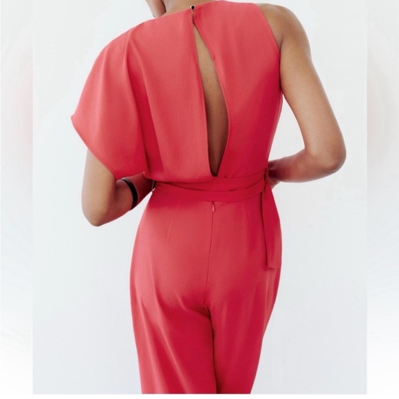 ASYMMETRIC CREPE BUCKLE JUMPSUIT
RED / CORAL . SIZE M, L - Picture 9 of 16